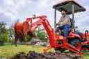 BX23S backhoe tractor digging